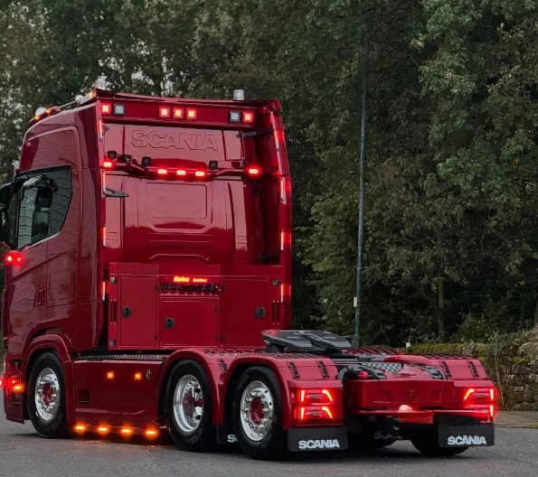 Red Scania truck showing DR Transport's professional fleet